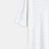 Witte gebreide poloshirt met structuurpatroon