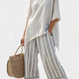 Fiorella – elegante asymmetrische blouse en gestreepte broeken