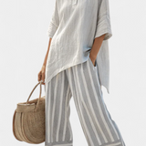 Fiorella – elegante asymmetrische blouse en gestreepte broeken