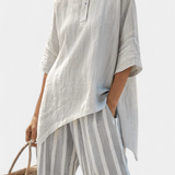 Fiorella – elegante asymmetrische blouse en gestreepte broeken